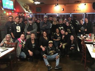I am in the center with my arms folded. These are regulars that attend Saints games at the Angry Crab Restaurant in Phoenix. It is on Indian School Road. This is a part of our group. 